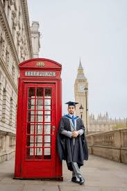 Our Happy Client Moin Ovi Posed Photo beside Red Telephone booth in London. Who Rated London Snap 5 Star st Trust Pilot.